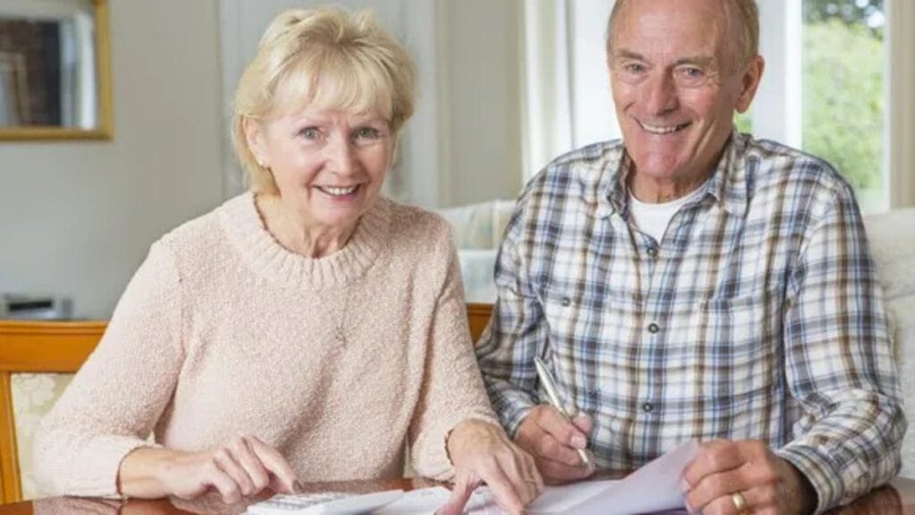 senior couple smiling about finances retirement getty large11