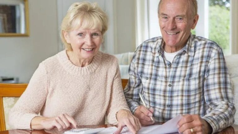 senior couple smiling about finances retirement getty large11