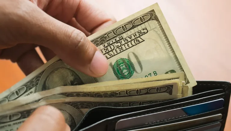 70656447007 wallet count cash bills money four hundred dollars credit card invest retire getty 1