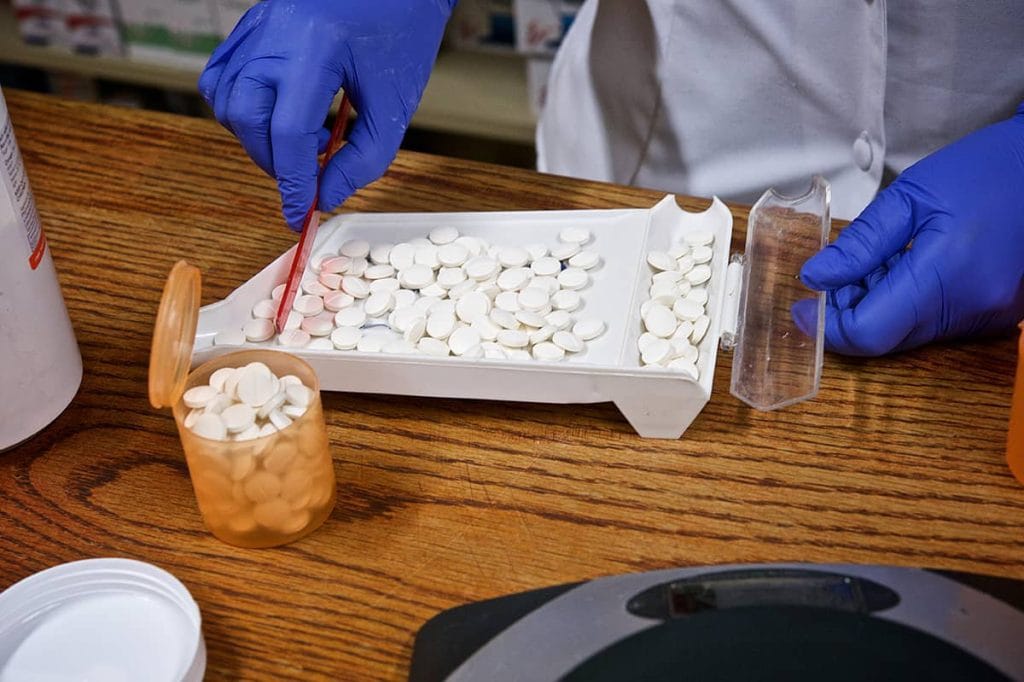 Kenya’s Proposed VAT Shift on Medicines Raises Alarm Over Drug Access and Health Equity pharmacist counting pills 844345500 iStock wilpunt